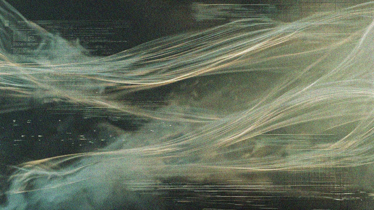 Abstract light trails across a dark, grainy ground